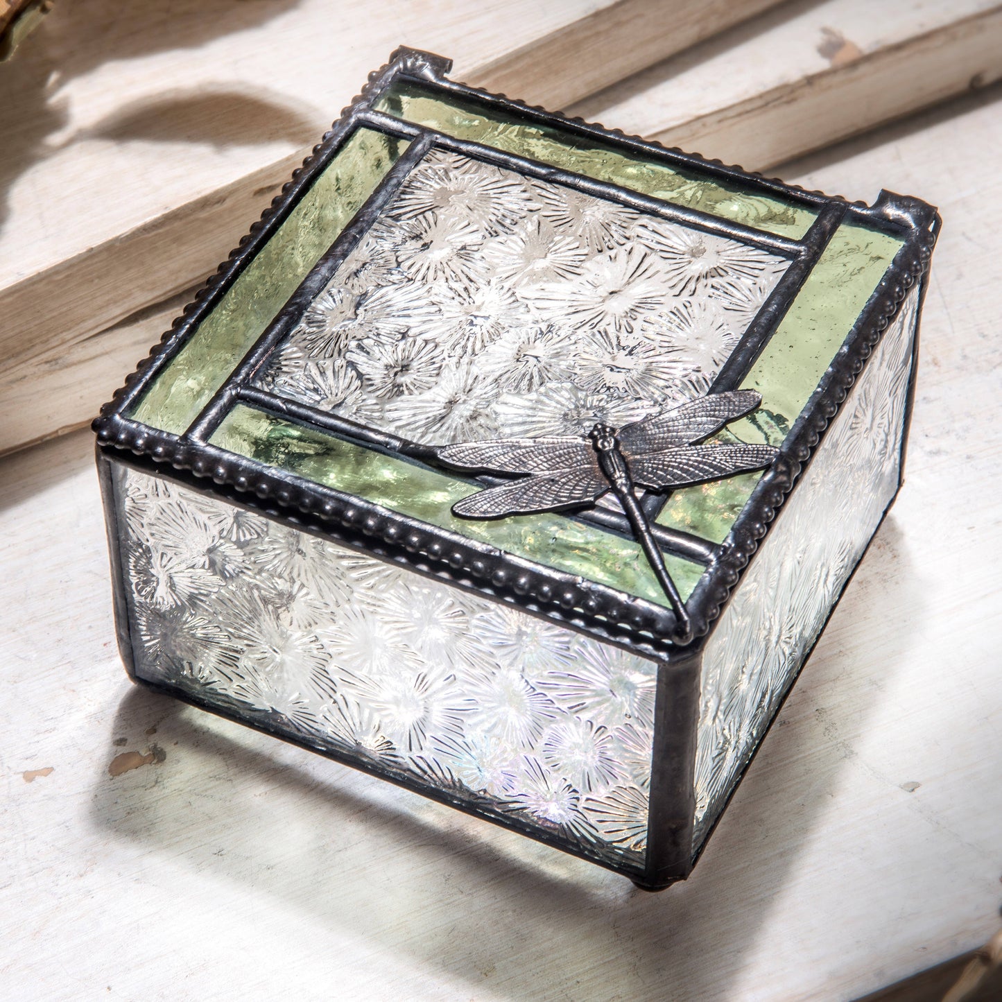 Stained glass keepsake box with green trim and dragonfly embellishment
