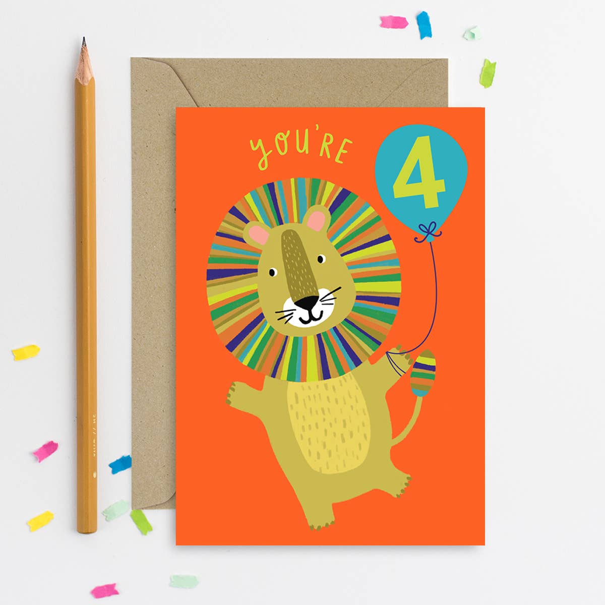 A colorful, handmade lion birthday card with a rainbow mane and "YOU'RE 4" balloon.