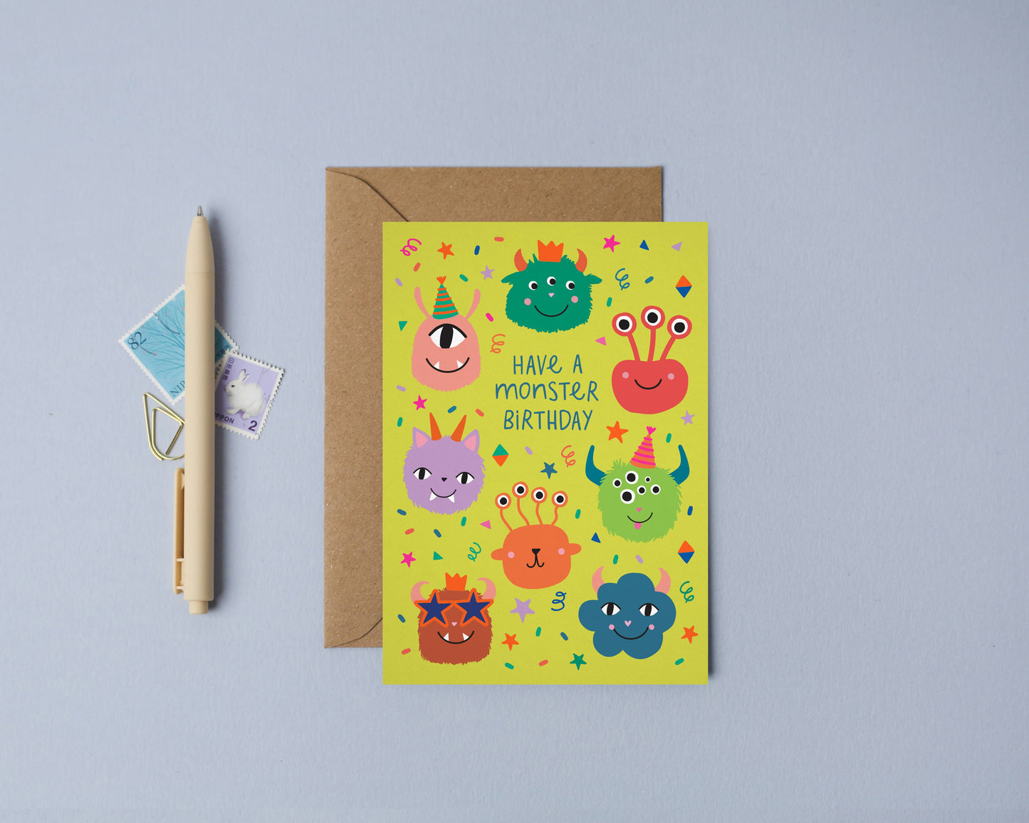 Children’s birthday card with colorful illustrated monsters and neon accents