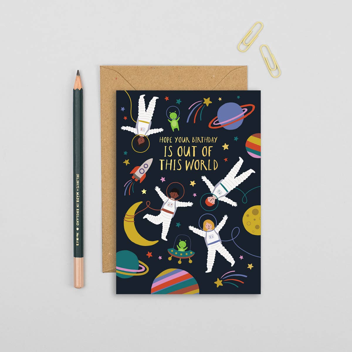 Children's birthday card with astronauts, colorful planets, and space theme