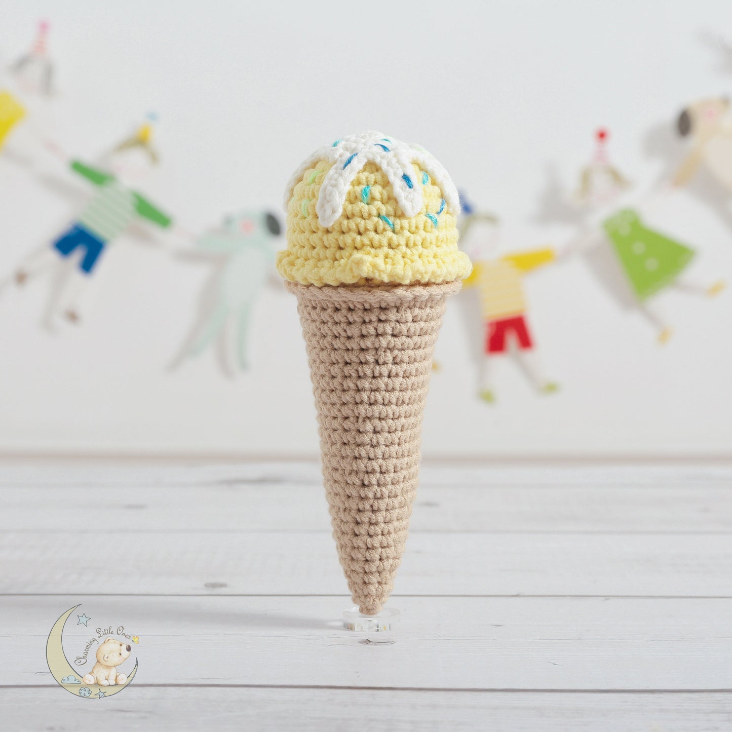 A handmade crochet ice-cream toy set with a yellow scoop and sprinkles on top, 6 inches tall.
