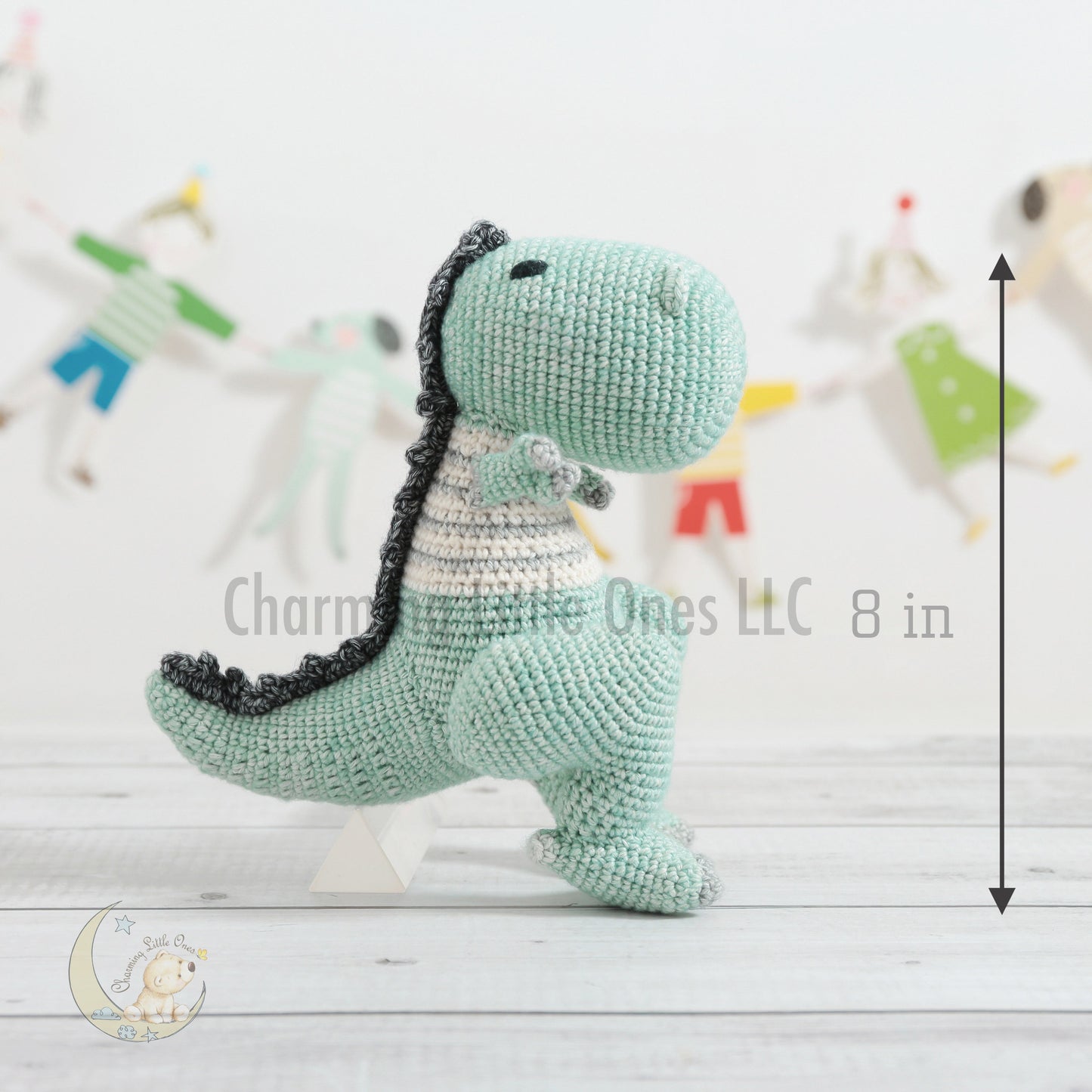 A handmade crochet TRex dinosaur toy in mint green, white, and gray, standing 8 inches tall.