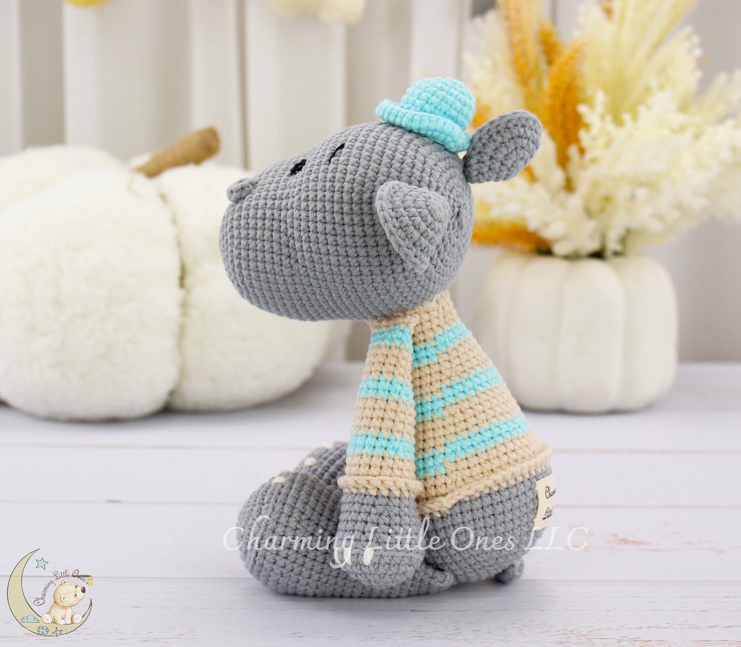 Handmade crochet hippo, 11 inches, gray with blue and beige striped scarf and hat.
