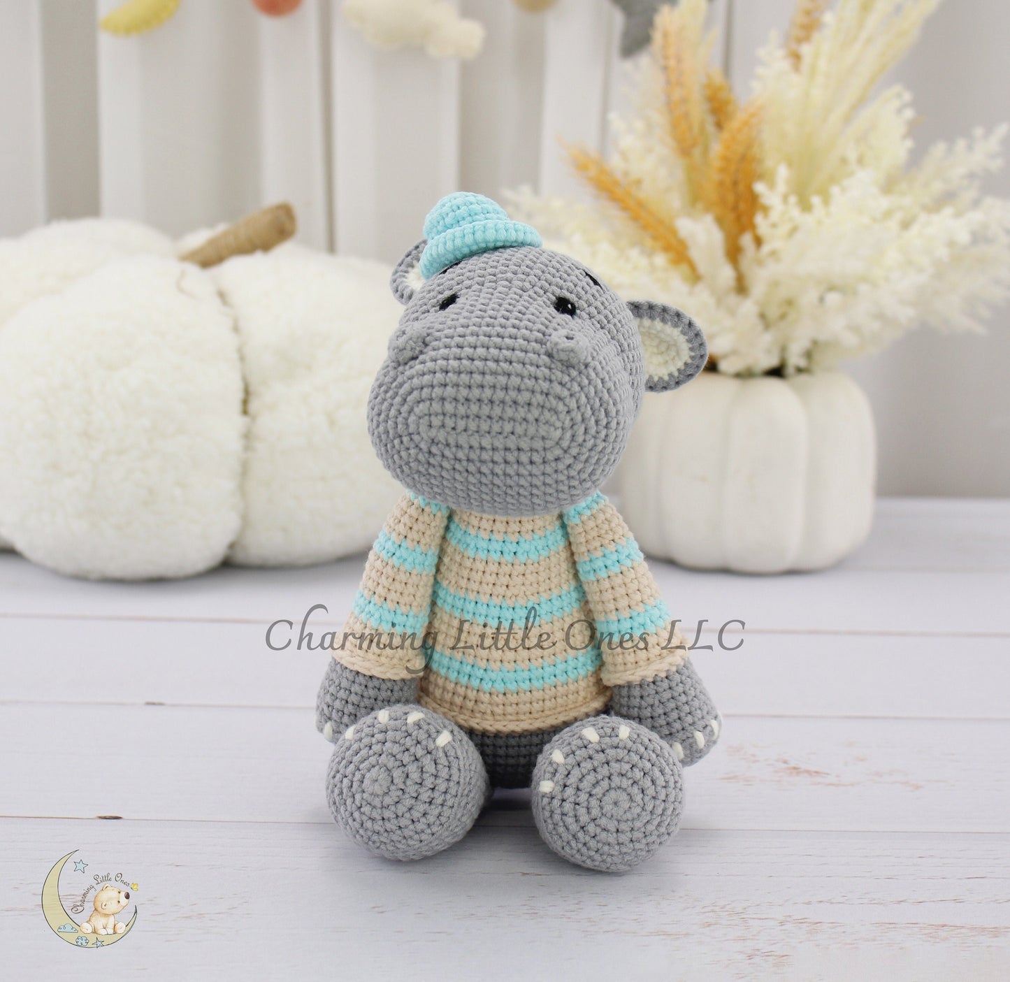 Handmade crochet hippo, 11 inches, gray with blue and beige striped sweater and hat.