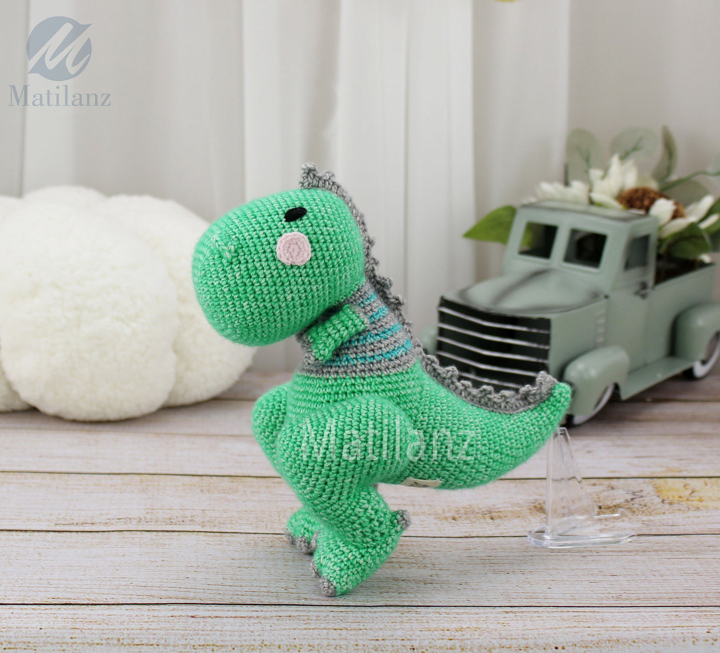 Handmade crochet dinosaur T-Rex, 8 inches tall, in bright green with gray accents and a playful design.