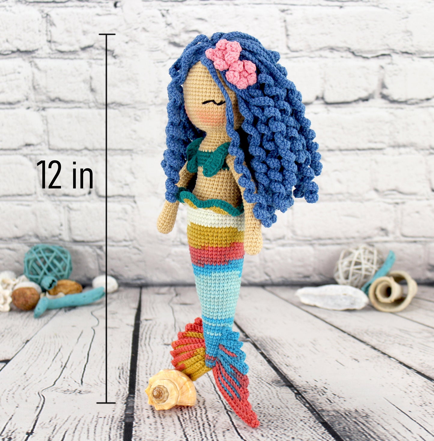 Handmade crocheted mermaid doll with long blue hair and colorful fin, wearing a bikini, 12 inches tall.