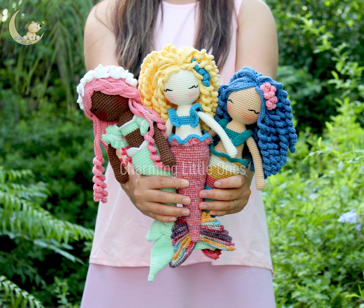Handmade crochet mermaid doll with blonde hair, blue top, and colorful tail, perfect for imaginative play.