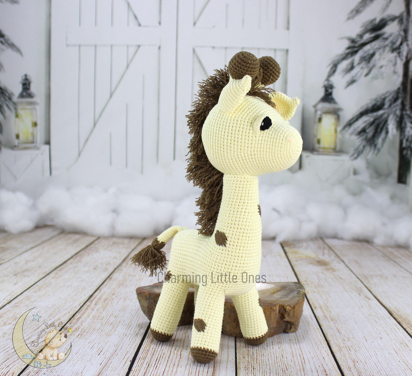 Handmade crochet giraffe, 14.5 inches tall, with a creamy body, brown spots, and a fluffy mane.
