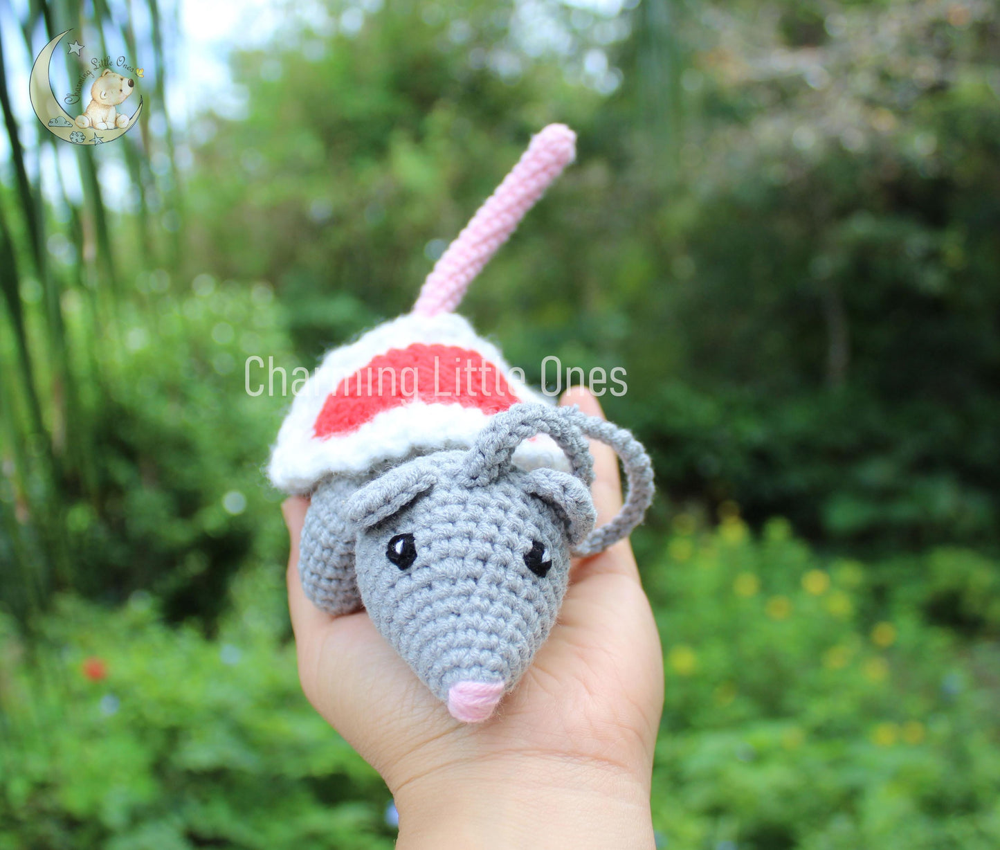 Handmade crochet Christmas mouse ornament, gray with red Santa hat, perfect for festive decorating.