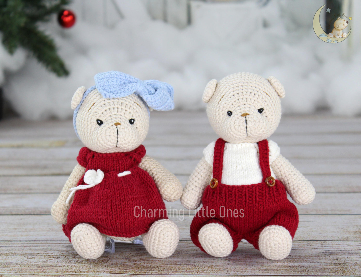 Handmade crochet Christmas bears in red outfits, one with a blue bow.