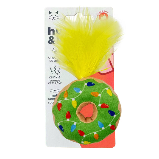 Green donut-shaped cat toy with colorful holiday lights and yellow feather