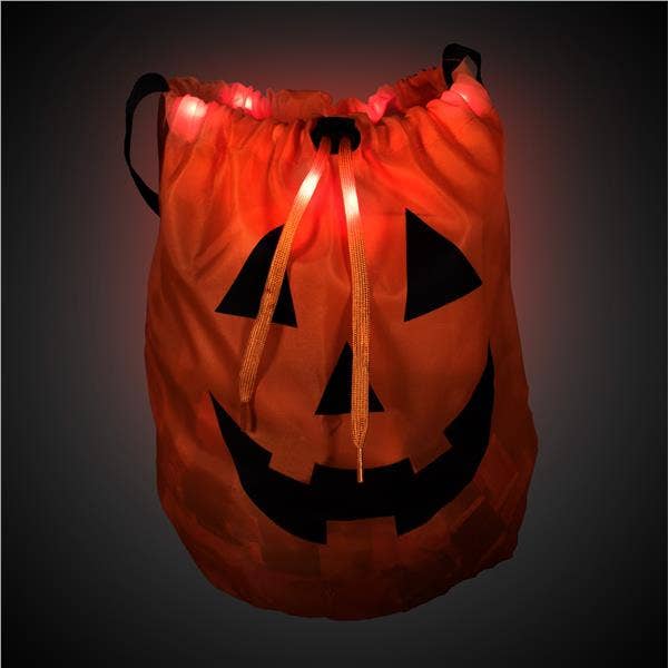 Orange drawstring bag with Jack O' Lantern face and glowing red LED lights