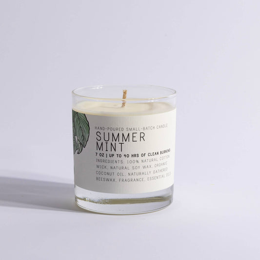 Glass candle labeled Summer Mint with natural ingredients