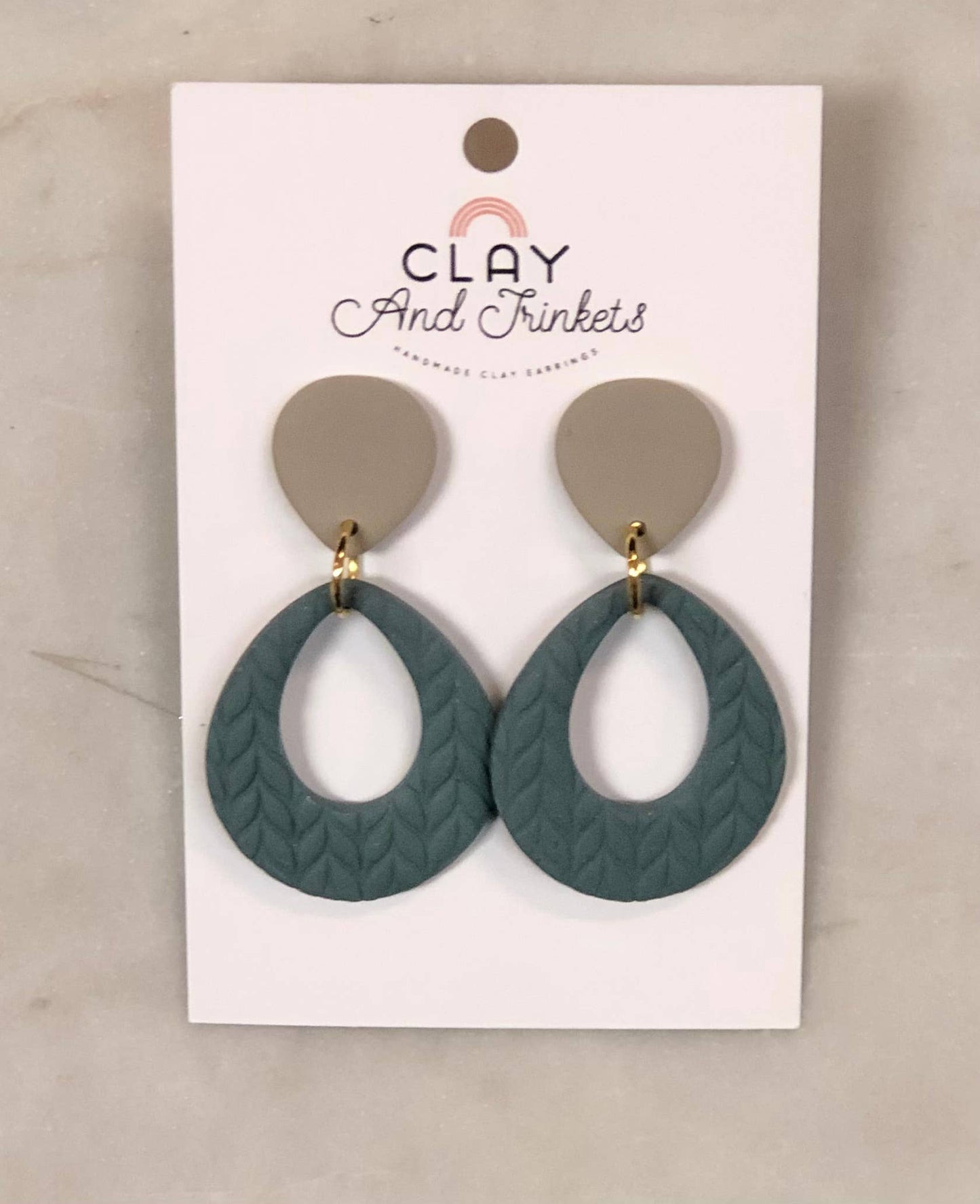 Teardrop clay dangle earrings with textured green bottom and beige top