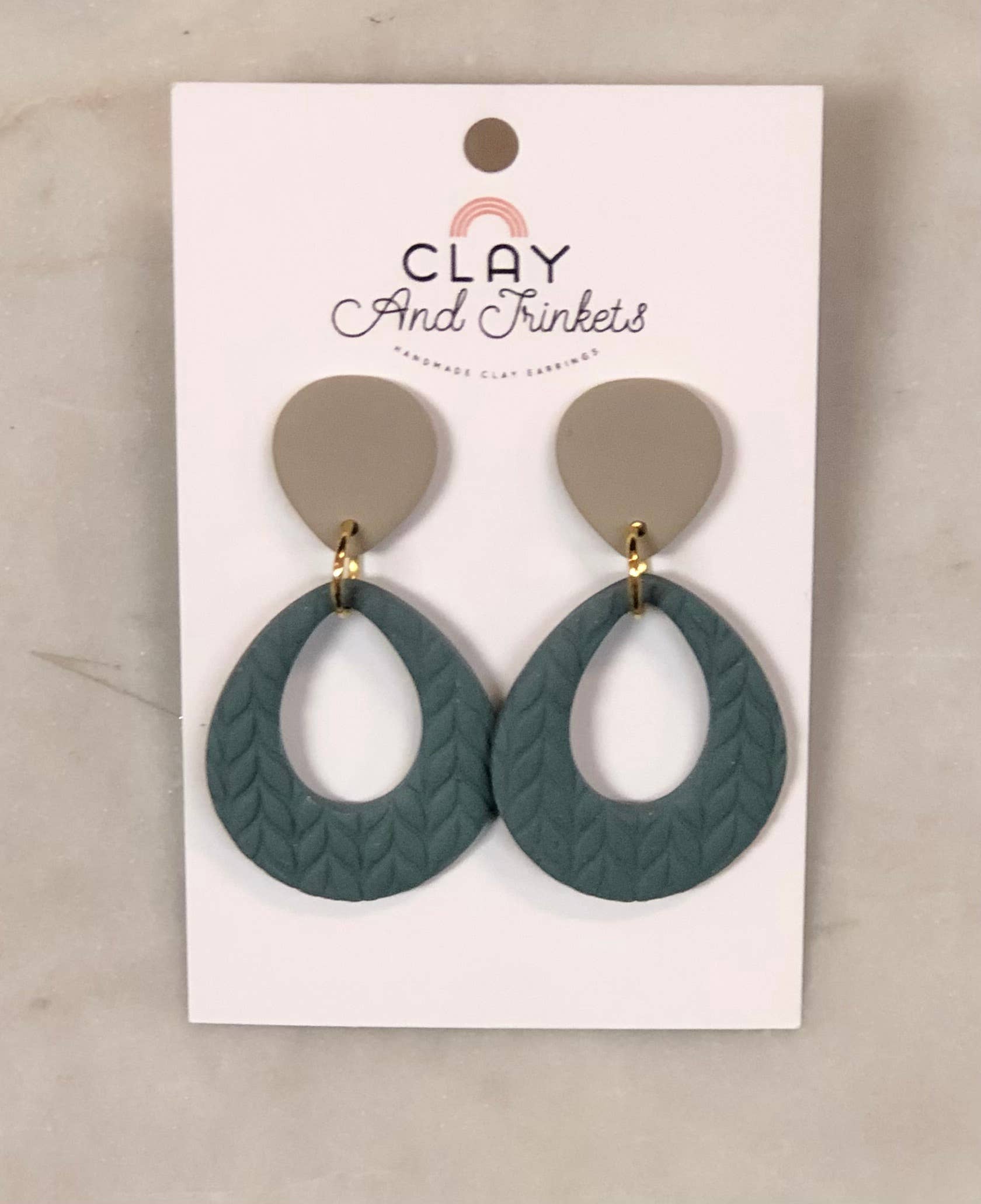 Teardrop clay dangle earrings with textured green bottom and beige top