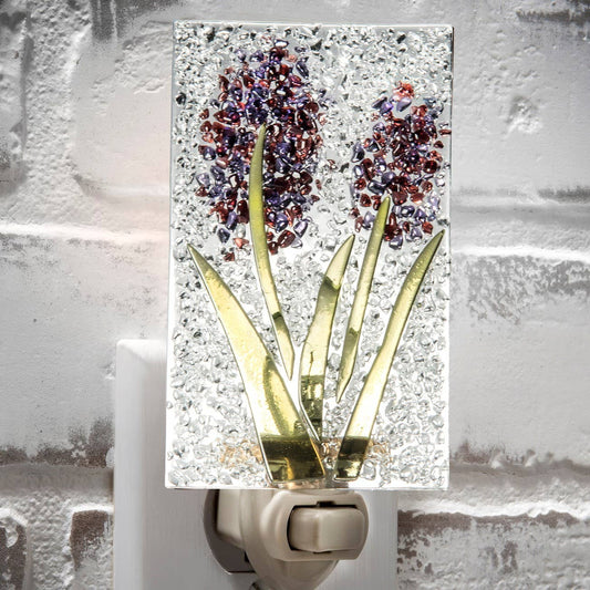 Fused glass flower night light with purple blooms and textured clear background