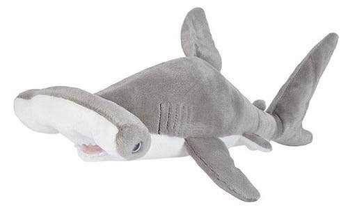 Gray plush hammerhead shark with white belly and wide head, posed as if swimming.