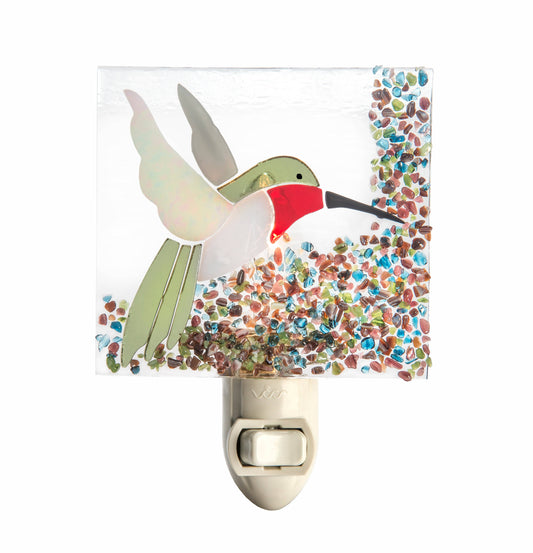 Fused glass night light featuring a colorful hummingbird design with vibrant multicolor mosaic details.