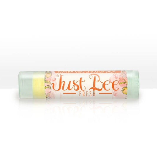 Citrus-scented Just Bee Fresh lip balm in a pastel tube