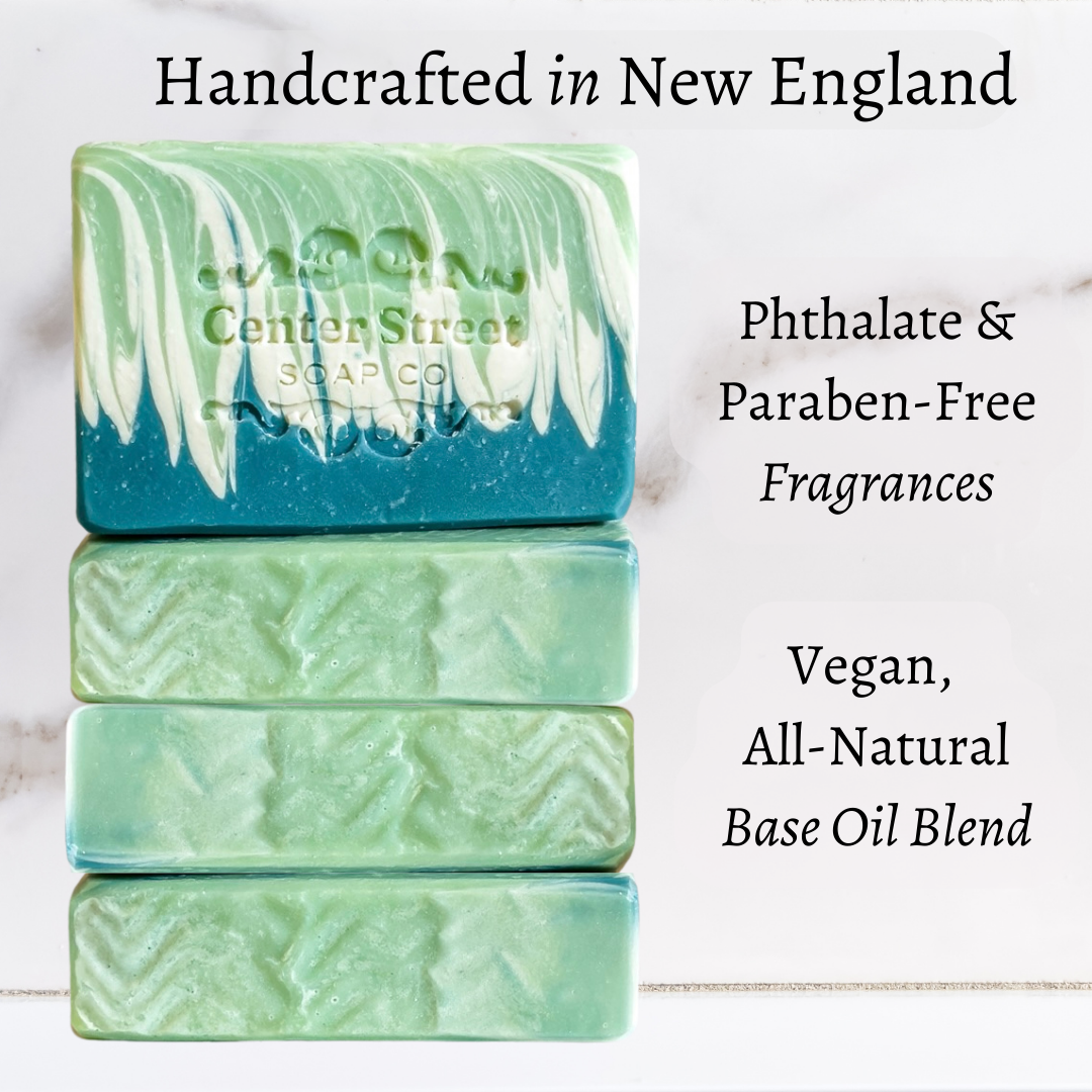 Handmade vegan soap bar with spearmint and eucalyptus, featuring a refreshing scent and a green and blue swirled design.