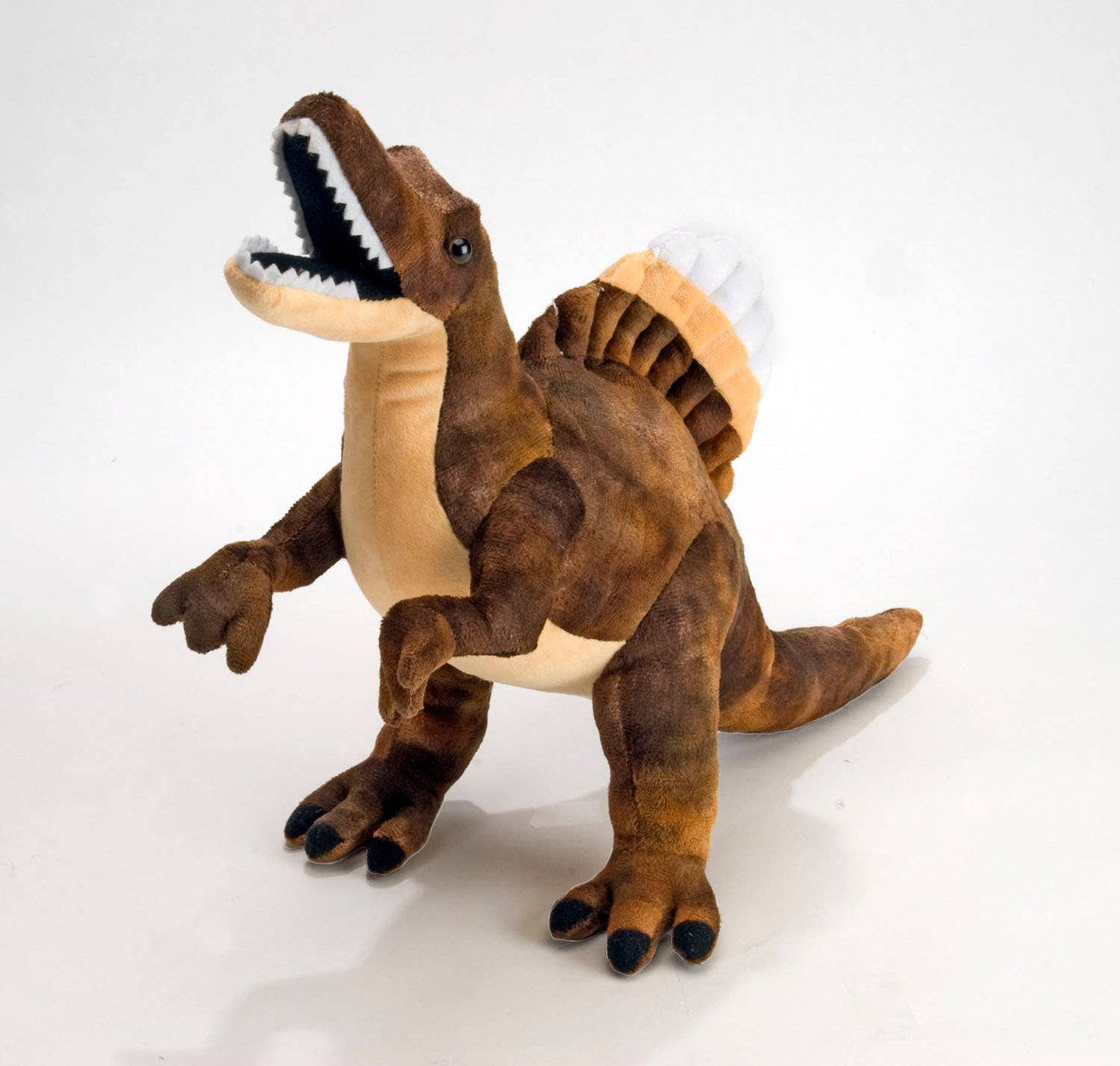 Brown and beige plush Spinosaurus dinosaur toy standing upright with open mouth and stitched teeth.
