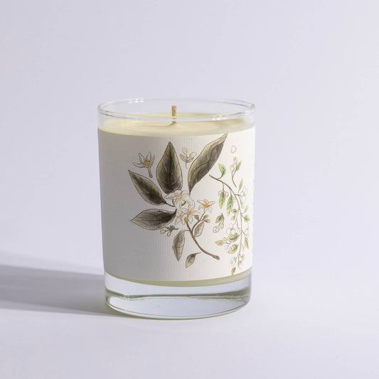 Large glass candle featuring floral jasmine and orange blossom design