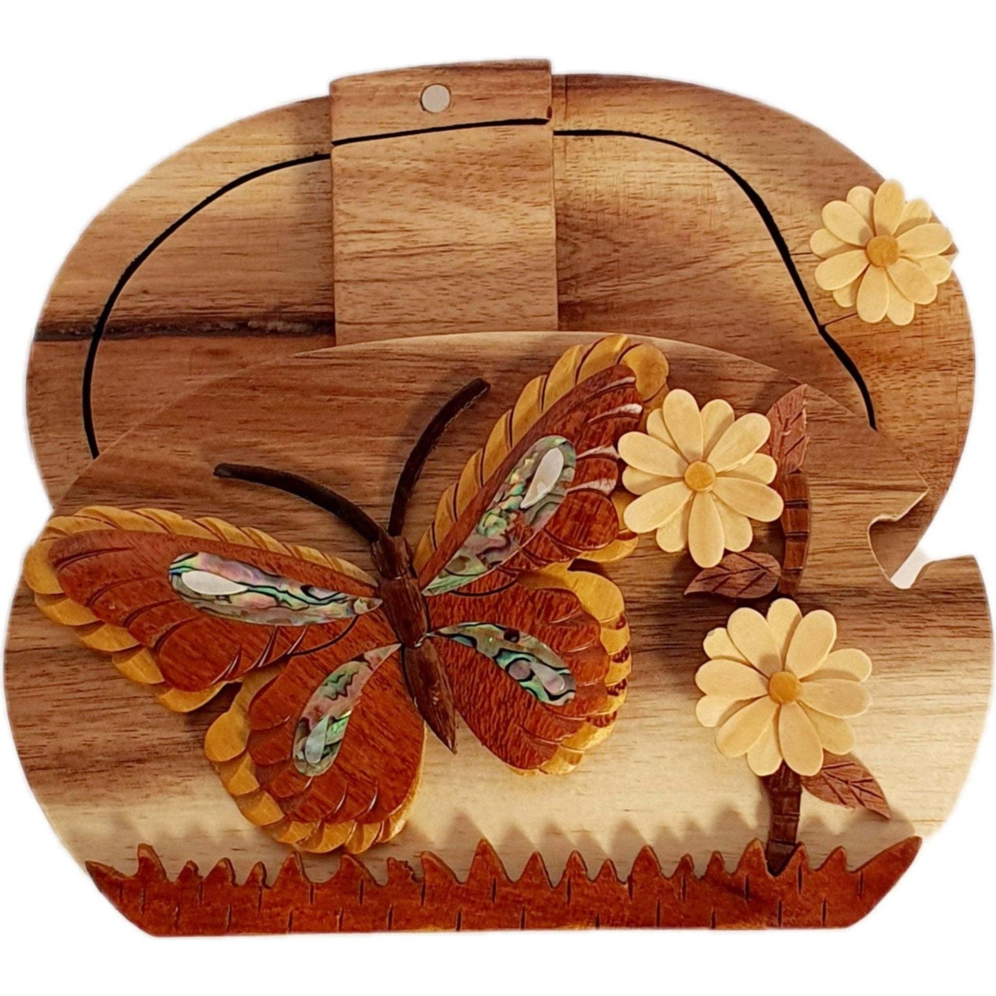 Hand-carved wooden keepsake box with a butterfly and daisies, featuring mother of pearl inlay.