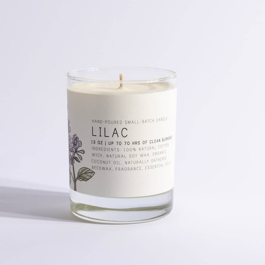 Glass jar candle labeled Lilac with minimalist floral design