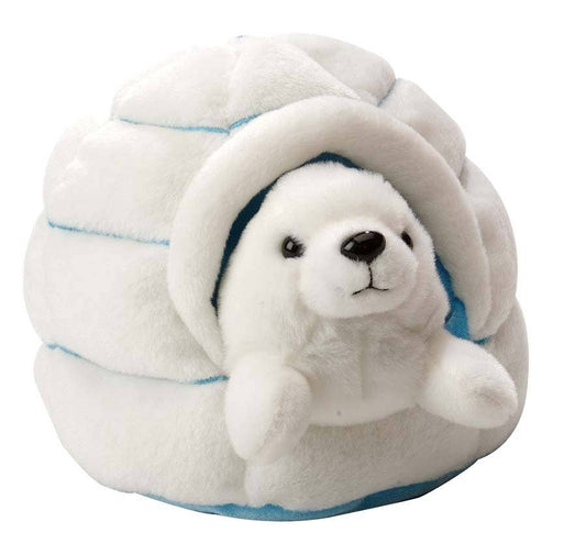 White plush harp seal resting inside a soft igloo toy