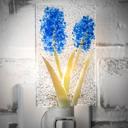 Glass night light with blue fused glass flowers and clear textured background