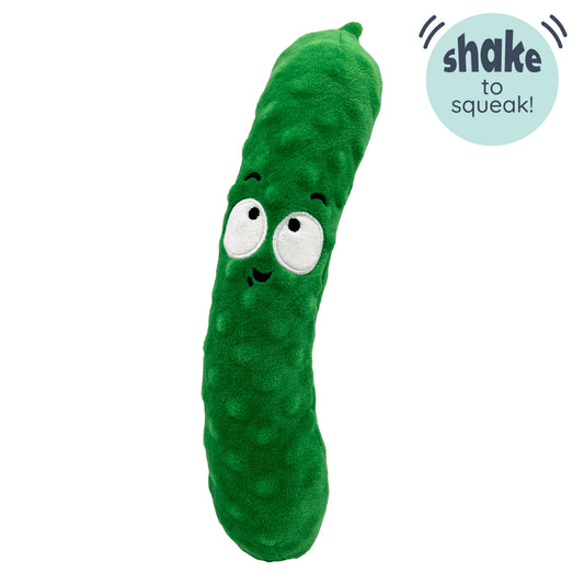 Green pickle-shaped dog toy with embroidered eyes and soft texture