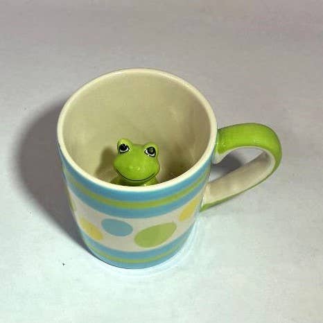 Striped toddler cup with hidden green frog inside