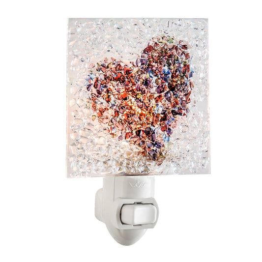 Fused glass heart night light with iridescent multicolor chips, perfect for a cozy glow.