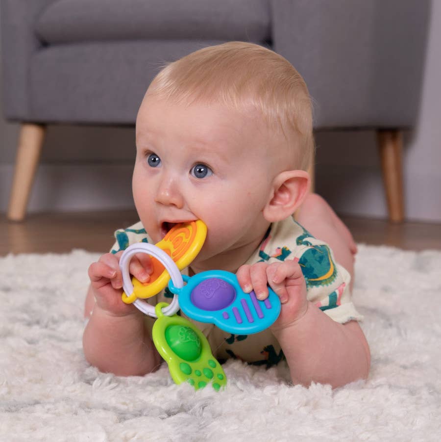 Brightly colored sensory ring toy set with soft, textured rings and teething-friendly shapes for baby play.