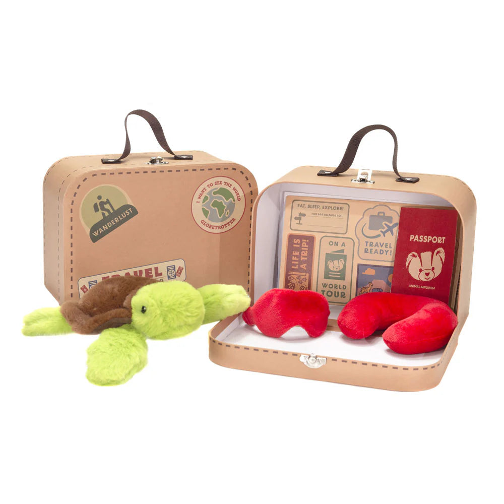 Toy travel set with a green turtle plush, red pillow, and mini suitcase