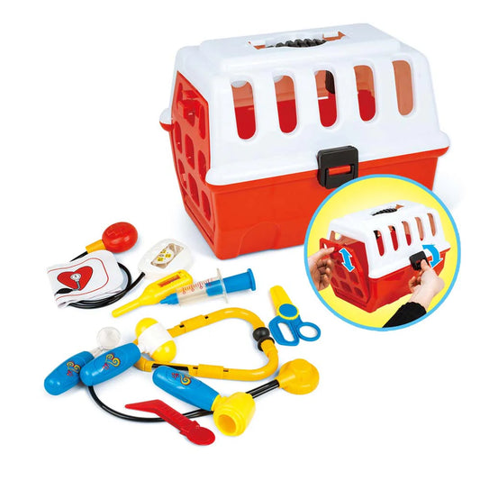 Red and white pet carrier toy with matching medical accessories including syringe, stethoscope, scissors, and thermometer, shown with hands opening the latch.