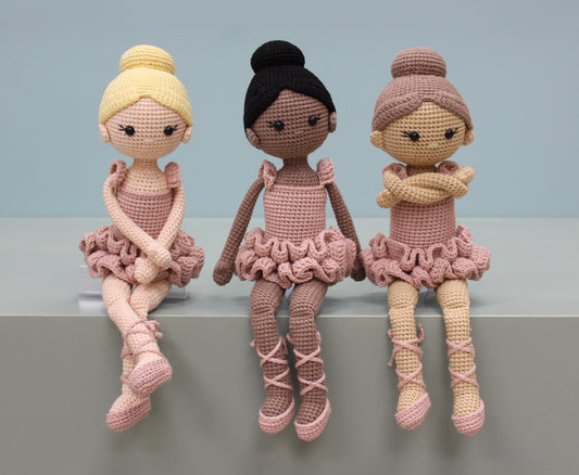 Handmade crochet ballerina doll plush in three shades with ruffled skirts and ballet shoes.