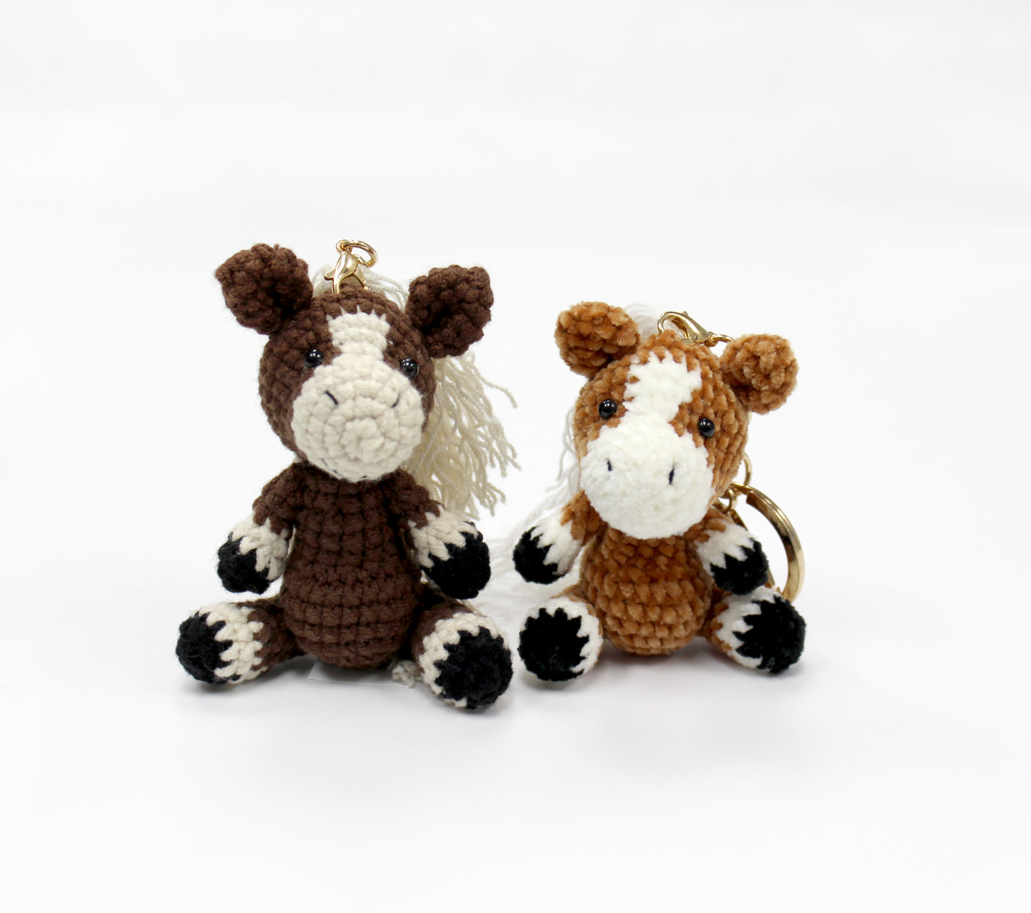 Handmade crochet amigurumi horse keychains, mini stuffed animals, 3 inches tall, with detailed coloring and gold keyrings.