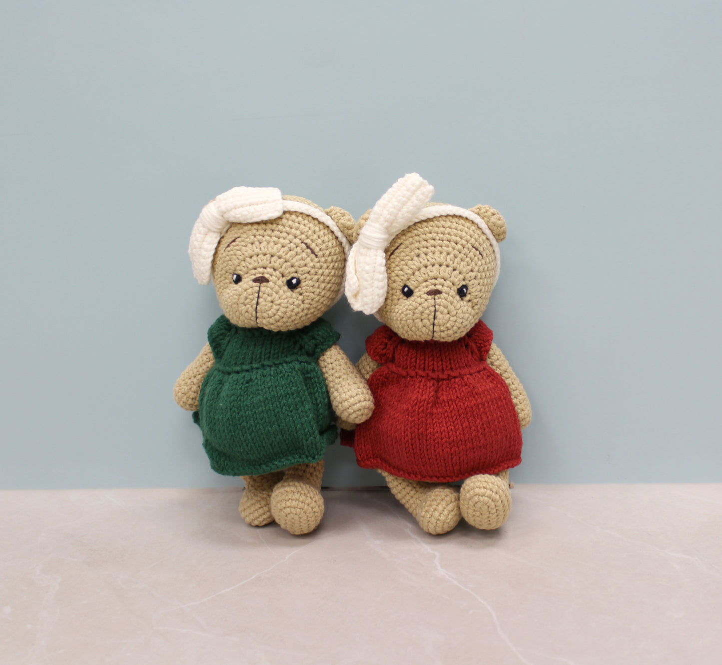 Handmade 8-inch teddy bear dressed in a festive red outfit with white earmuffs, perfect for Christmas.