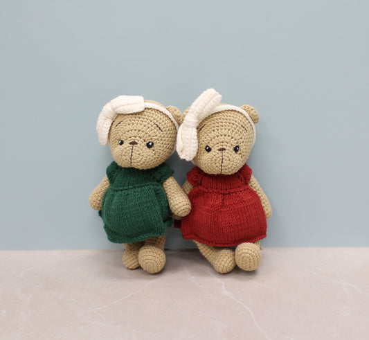 Handmade 8-inch teddy bear dressed in a festive red outfit with white earmuffs, perfect for Christmas.