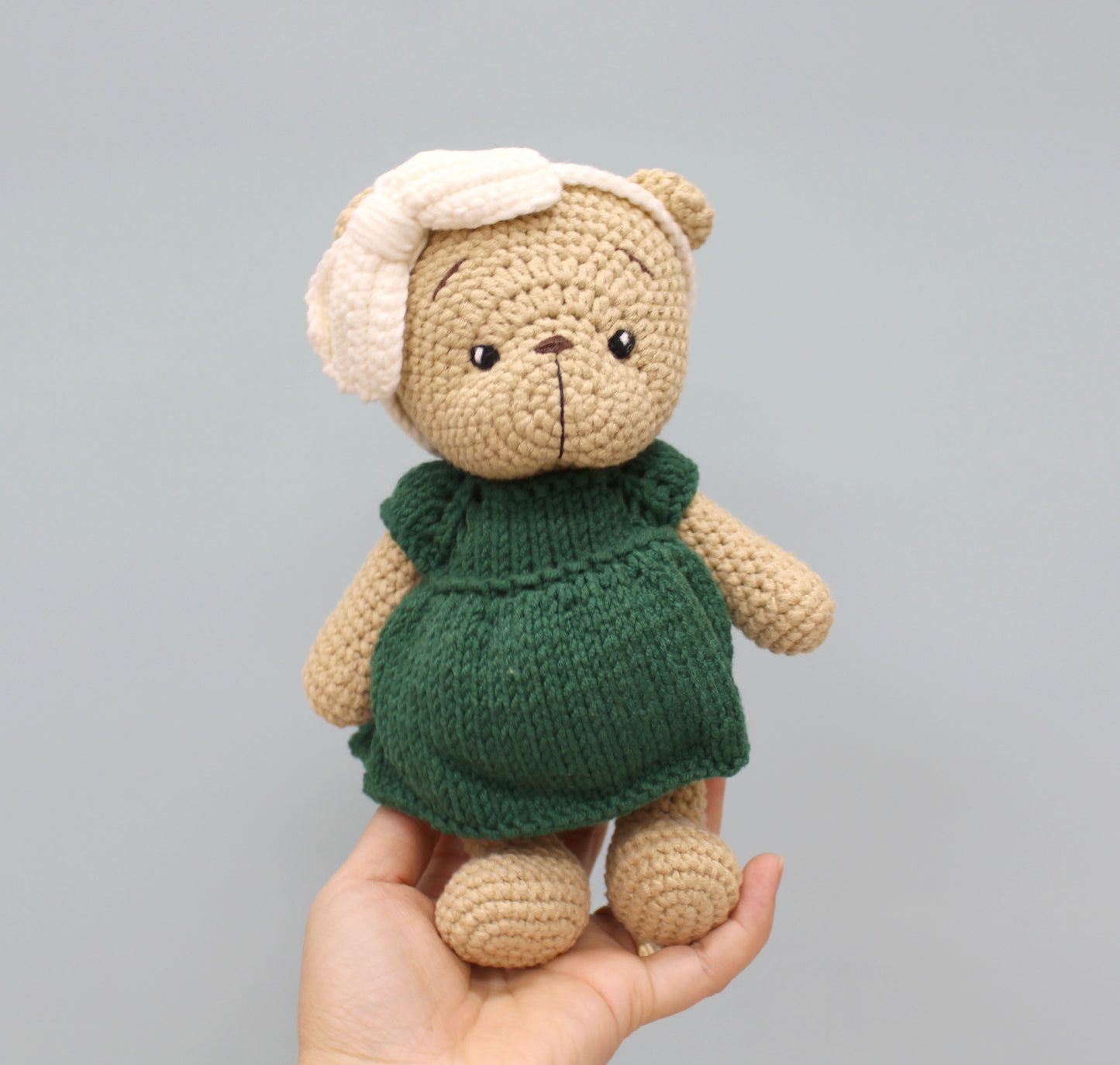 Handmade 8-inch teddy bear in a green dress and white bonnet, perfect for Christmas.