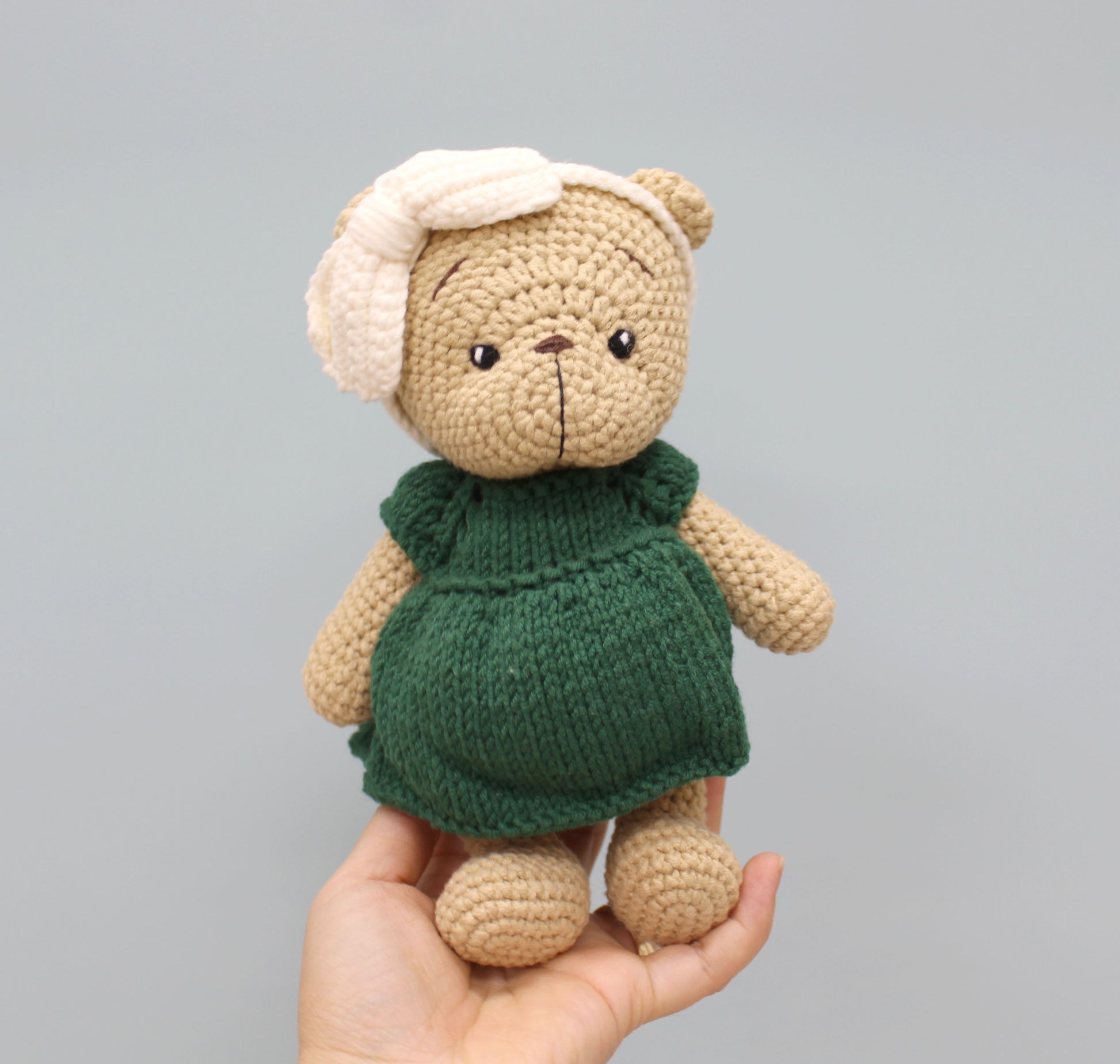 Handmade 8-inch teddy bear in a green dress and white bonnet, perfect for Christmas.