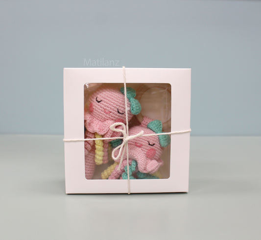 Handmade crochet jellyfish baby rattle toy set in pink and teal, made from 100% cotton.