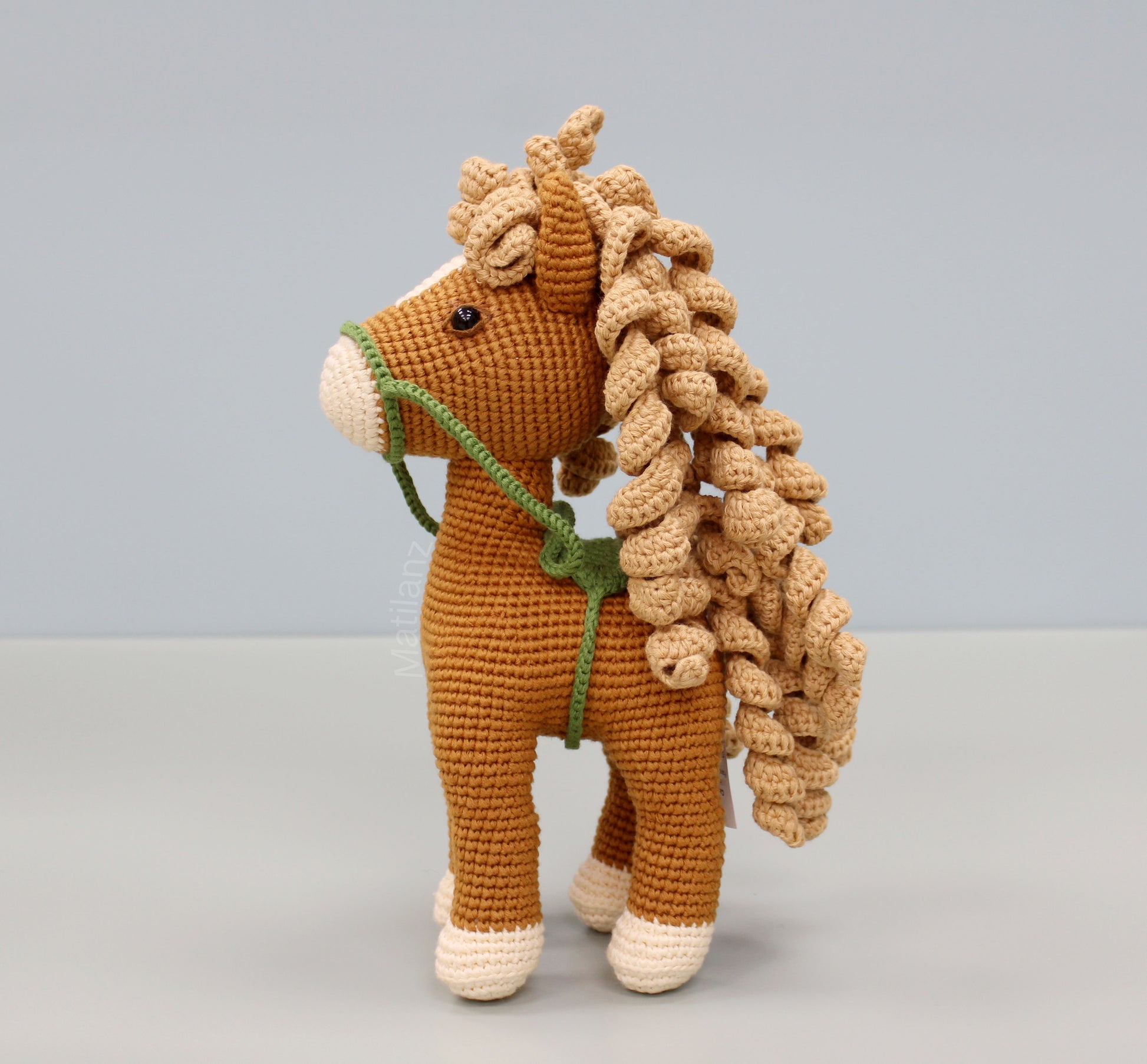 Handmade crochet horse soft toy in copper color with curly mane and tail, cotton material, 10 inches tall.