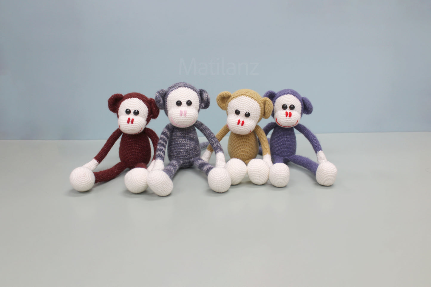 Handmade crochet monkey stuffed toy, 13 inches, in assorted colors with white hands and feet.