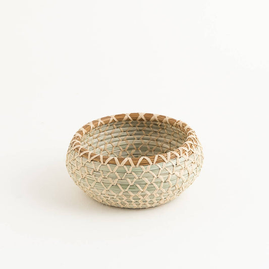 Small handwoven round basket with pine needle detail