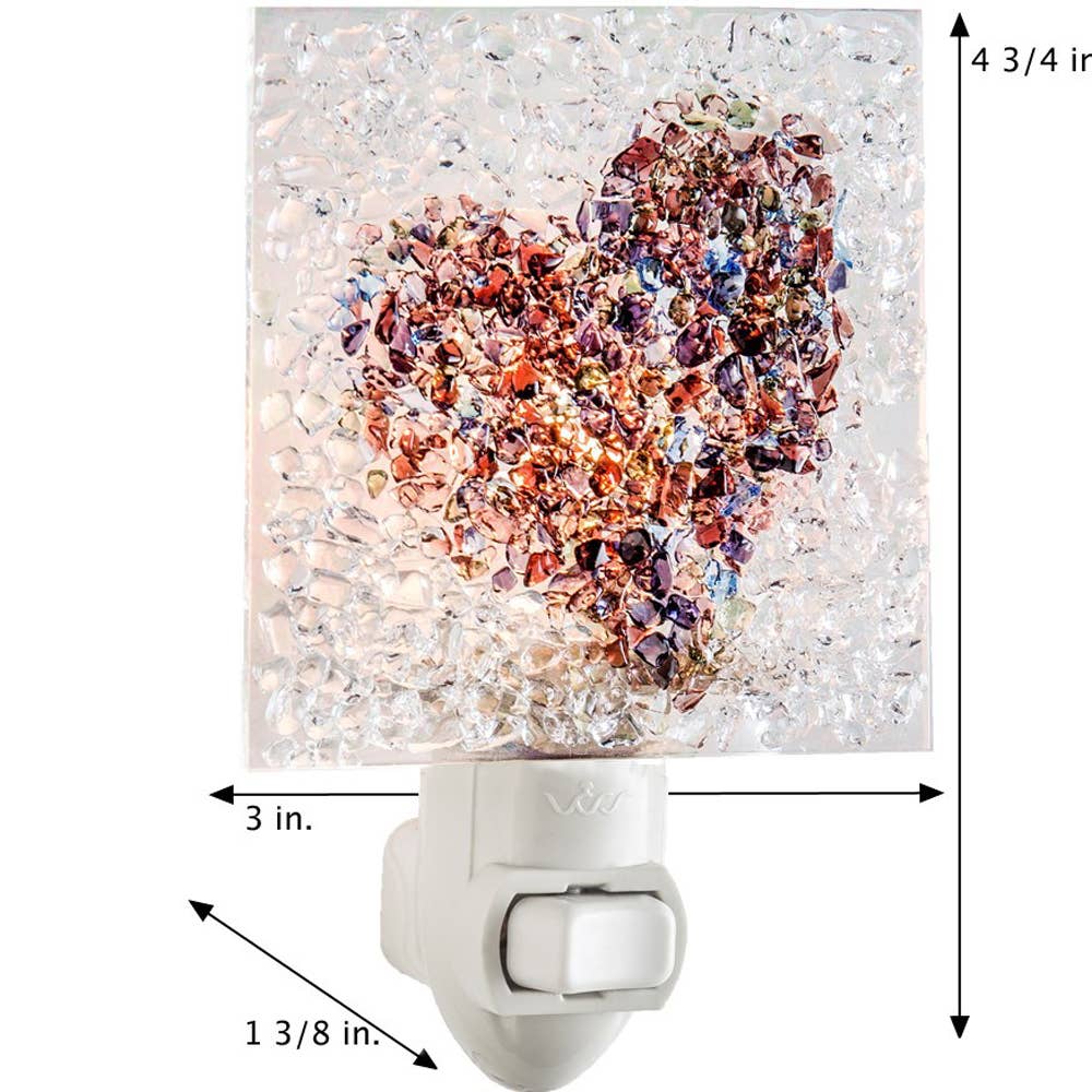 Fused glass heart night light with iridescent multicolor chips, perfect for adding a warm glow.