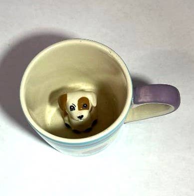 Ceramic baby cup with a surprise puppy figurine inside