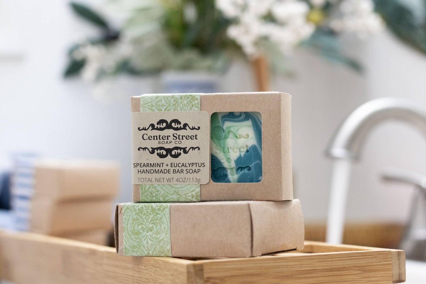 Handmade vegan soap bar with spearmint and eucalyptus scent, wrapped in eco-friendly packaging.