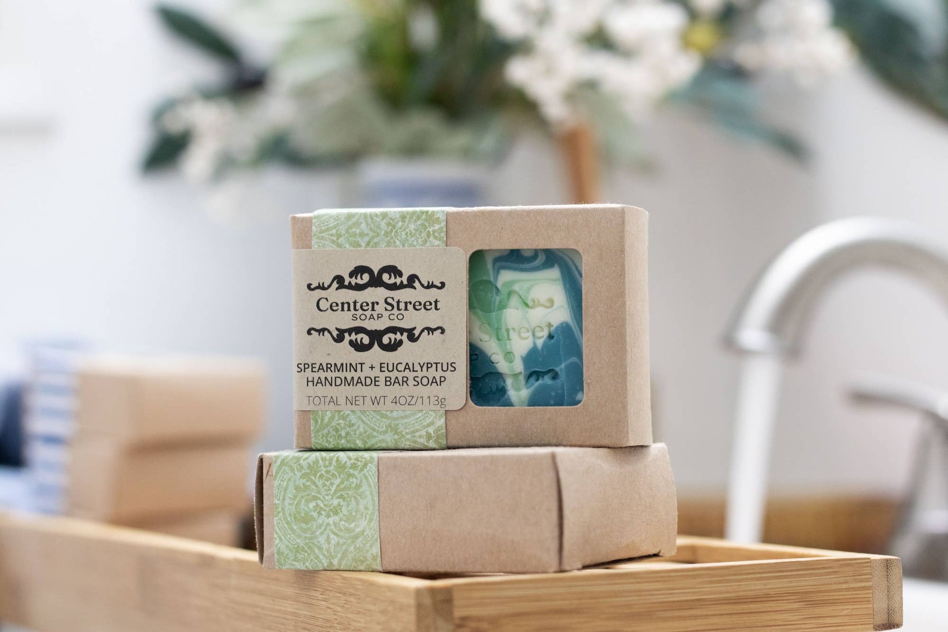 Handmade vegan soap bar with spearmint and eucalyptus scent, wrapped in eco-friendly packaging.